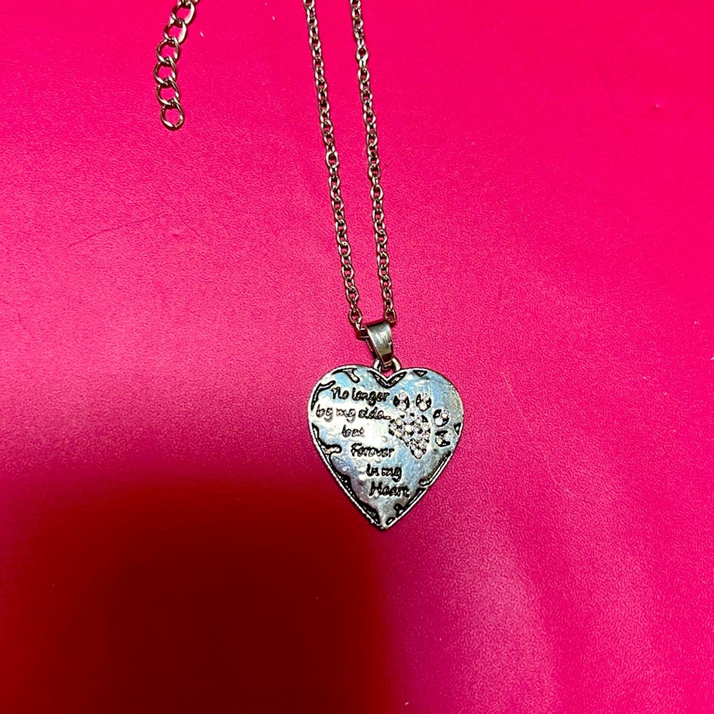 Brand new necklace with the bling paw prints